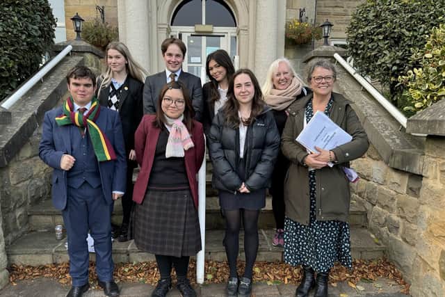 Supporting wellbeing in the community - Pupils from Harrogate's Ashville College outside Adelphi Care Home on Harrogate’s Cold Bath Road where they sang and played for residents. (Picture contributed)