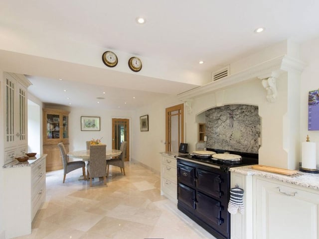 An open-plan kitchen has maintained a style that compliments the period features of the property.