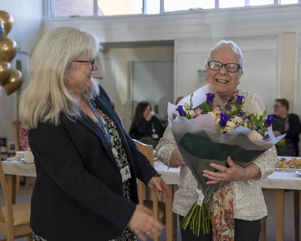 North Yorkshire Council’s assistant director for adult social care and support, Rachel Bowes, presents Harrogate's Dot Hope with a bunch of flowers on her retirement. (Picture contributed)