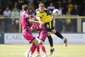 Harrogate Town defender Toby Sims wins a header during Saturday's 1-0 home defeat to Forest Green Rovers. Picture: Paul Thompson/Pro Sports Images