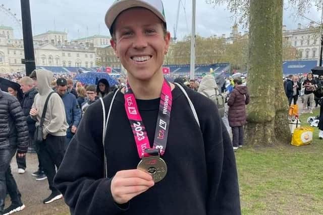Harrogate's Charlie Higgins picking up his 2023 London Marathon finishers medal yesterday.