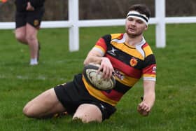 Harrogate RUFC's Conor Miller touches down during Saturday's home win over Alnwick RFC. Pictures: Gerard Binks