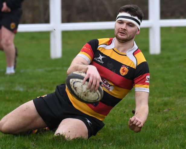 Harrogate RUFC's Conor Miller touches down during Saturday's home win over Alnwick RFC. Pictures: Gerard Binks