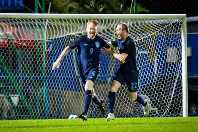 Ex-Harrogate Railway attacker Colin Hunter, right, celebrates with England team-mate Steve Jones.