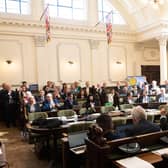 County councillors in the council chamber.