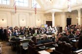 County councillors in the council chamber.