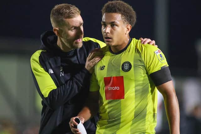 Harrogate Town manager Simon Weaver offers on-loan Wolverhampton Wanderers defender Lewis Richards some words of advice.