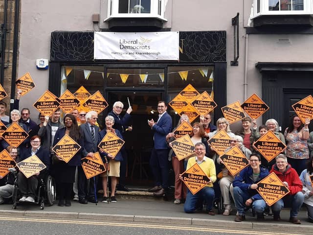 Flanked by the Lib Dem’s Harrogate and Knaresborough parliamentary candidate Tom Gordon, Lord Willis was cheered by scores of Lib Dem volunteers as he cut the ribbon on the party’s new Harrogate office on Saturday morning. (Picture contributed)
