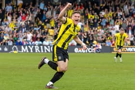 Toby Sims celebrates after seeing his 87th-minute header deflected in off Grimsby's Danny Rose to earn Harrogate Town a 2-2 draw at Wetherby Road. Pictures: Jez Tighe/ProSportsImages