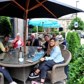 ustomers in the outdoors area of the Fat Badger bar, which is based at the White Hart Hotel on Cold Bath Road in Harrogate.