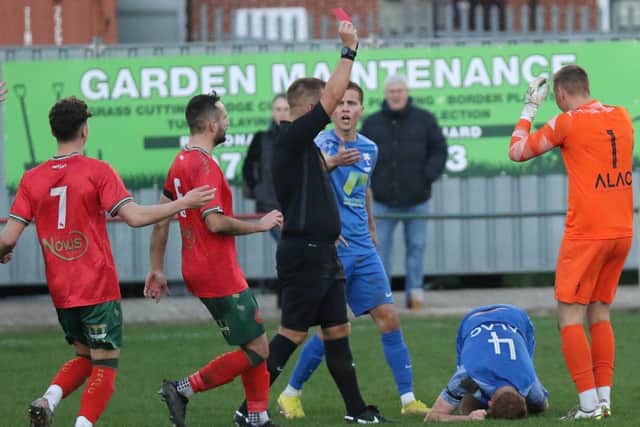 Rossington Main goalkeeper Kian Johnson was shown a straight red card after wiping out Harrogate Railway striker Albert Ibrahimi shortly after half-time.