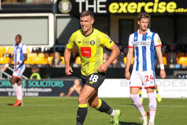 Jack Muldoon celebrates having put Harrogate Town 2-0 up before half-time during last month's League Two clash between the sides. Picture: Matt Kirkham