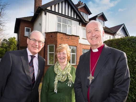Nigel McClea and Moira Start of Wellspring and the Rt Rev Nick Baines, the Bishop of Leeds, outside Wellsprings new premises.