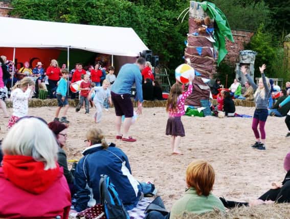 Families enjoying the Urban Beach at Henshaws Arts & Crafts Centre during last year's feva festival in Knaresborough.