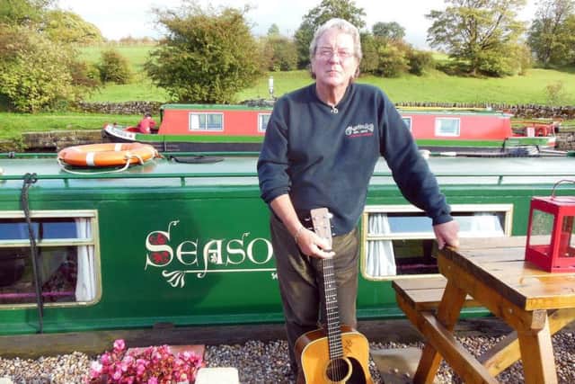 Acoustic rock legend Chris Simpson on his boat in his beloved Dales.