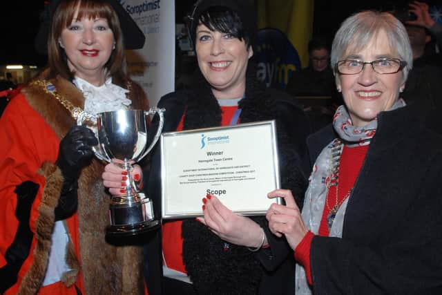 Assistant manager of the Scope charity shop Helen Hall collects the  winning  Charity Shops Award from The Mayor of Harrogate Coun Anne Jones and President of Harrogate Soroptimists Nicola Harding (1711162AM10).