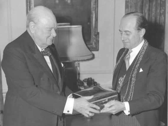 1944 - Sir Winston Churchill, British Prime Minister, receives a special cigar box from Ogdens Jewellers of Harrogate.