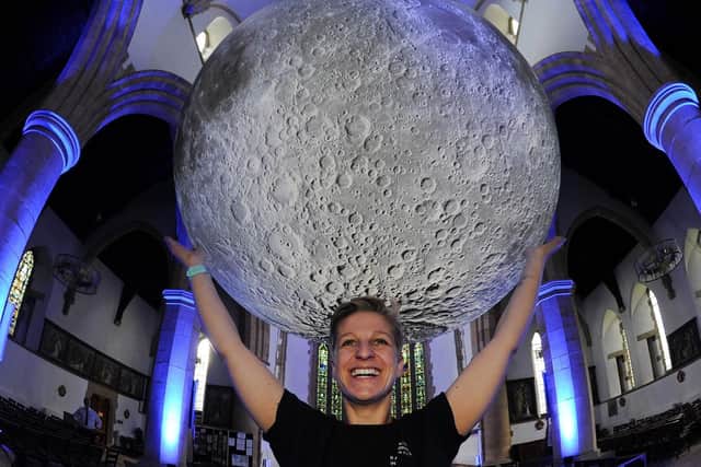 Pictured holding the moon in her hands: Charlotte Woods of Harrogate International Festivals. Picture: Gerard Binks.