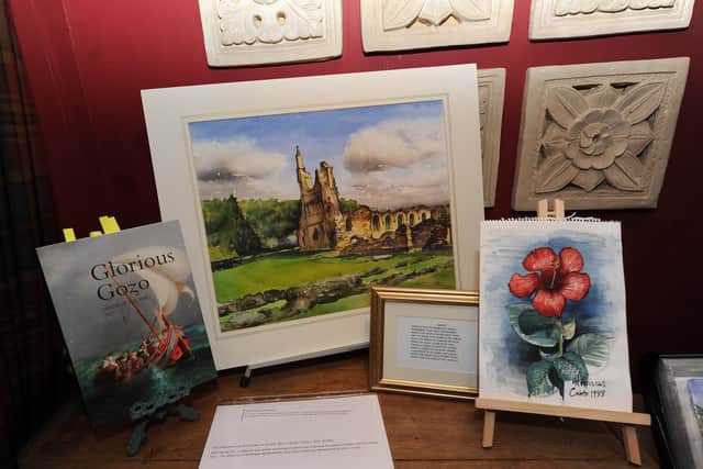 Some of Ronald's artwork on show at his wake. Picture: Gerard Binks.