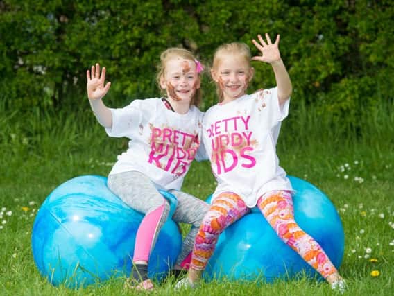 Heidi and Molly-Rose get ready for the Pretty Muddy obstacle course. Picture: Cancer Research UK
