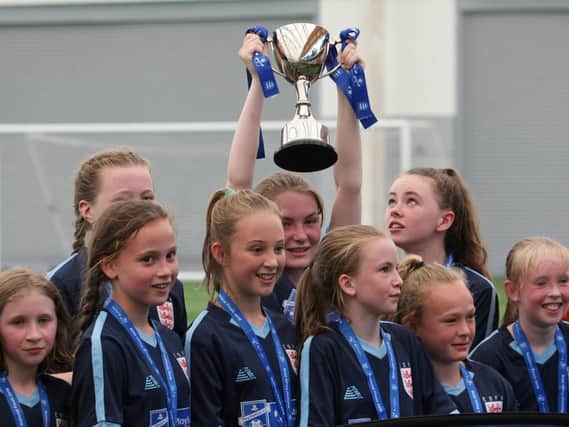 Champions! The Year 7 girls football team at St John Fishers in Harrogate have taken the National Final Cup. Credit: Russell Pearce