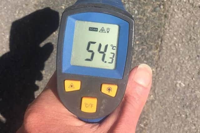 Rowen used an infrared thermometer to show residents just how hot the ground is at the moment.