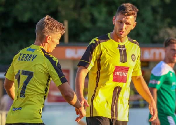 Aaron William, right, is congratulated by Lloyd Kerry after scoring his second goal against Brighouse. Picture: Matt Kirkham
