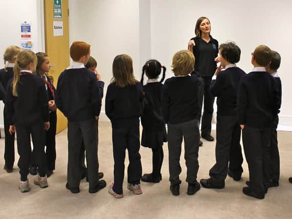 Success - Youngsters with Harrogate Theatre's head of education and Harrogate Youth Theatre Hannah Draper.