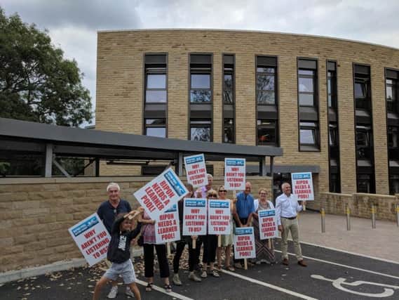 Campaigners outside Harrogate Borough Council's offices ahead of the meeting last week.