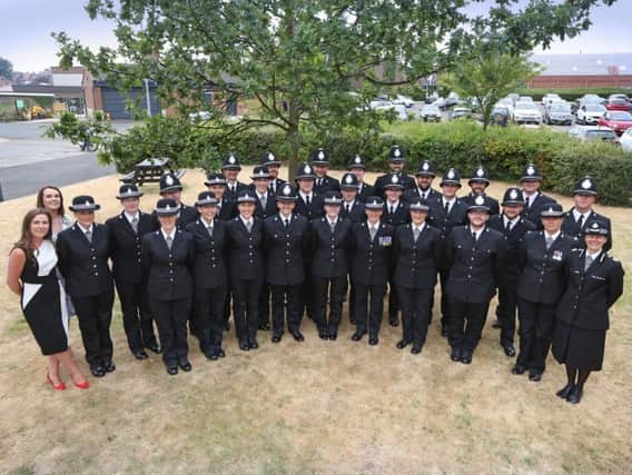 The group of 27 new officers who passed out on Friday are pictured at their passing out parade with their trainers and T/CC Lisa Winward (front right)