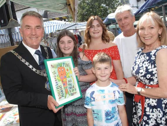 The Mayor of Knaresborough Coun Phil Ireland  with poster competition winner Jasmine Jacobs(11) her mum Sarah, brother Max(6) market trader and working group member Tony Kelly and Jean Carter secretary of the working group.