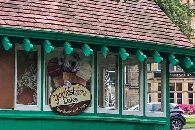 A close-up of the broken windows at the historic green shelter in Harrogate.