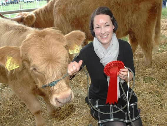 Laura Kennedy with her winning Highland calf Sarita of Hellifield