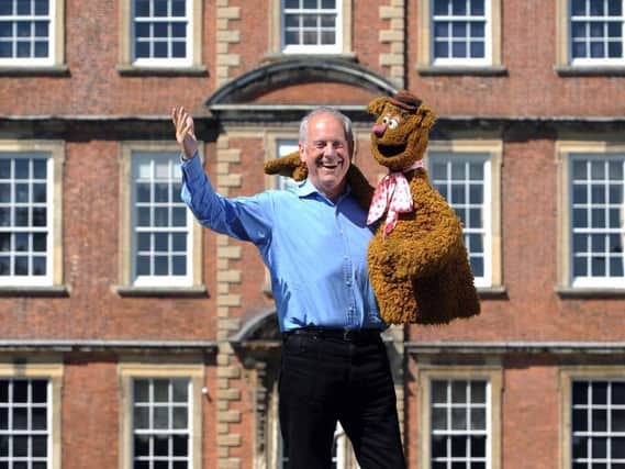 Popular broadcaster Gyles Brandreth outside Newby Hall with the real Fozzie Bear from The Muppet Show.