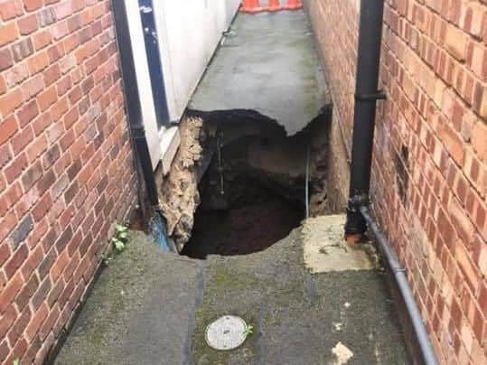 The sinkhole that opened up this morning behind Sainsbury's.