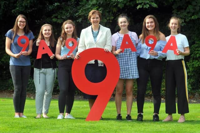 Sylvia Brett, Principal of Harrogate Ladies College celebrates excellent
GCSE results with pupils