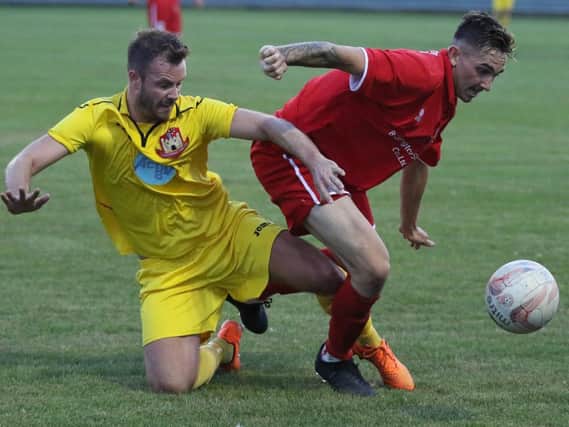 Knaresborough Town's Steve Bromley is dispossessed during Tuesday's defeat at Bridlington Town. Picture: Craig Dinsdale