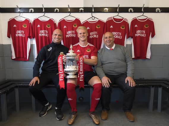 Knaresborough Town manager Paul Stansfield, left, club captain Well Lenehan and chairman Peter Plews with the FA Cup