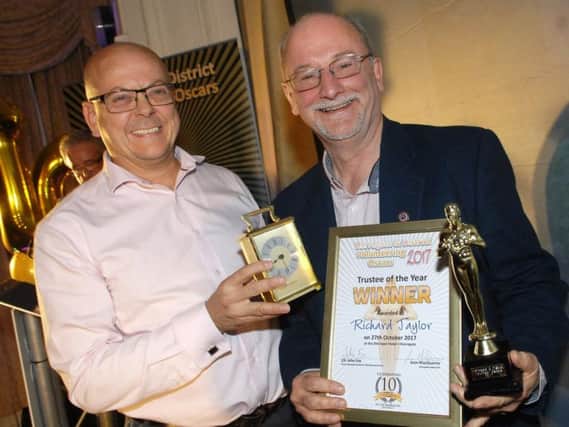 Shaun Newbould of CNG presents Richard Taylor with his Trustee of the Year Award at last year's Harrogate and District Volunteering Oscars. (1710274AM21)