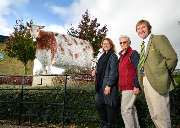 Emma Stothard's scuplture of the Craven Heifer is unveiled in its new permanent home at the entrance to the Great Yorkshire Showground in Harrogate. Picture (left to right) Emma Stothard, Margaret Chapman and Charles Mills.
