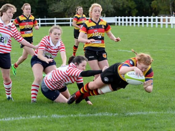 Unstoppable: Sarah Foster dives over the line during Harrogate RUFC Ladies' rout of Manchester. Pictures: Richard Bown