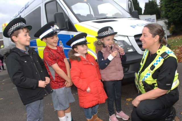 NAWN 1810133AM10 Wetherby Open Day. PC Jess Lane chats with Ben Kendrew(6), Luca Vladea-Holden(5), Lottie Poole(6) and Annabel Kendrew(4) (1810133AM10)