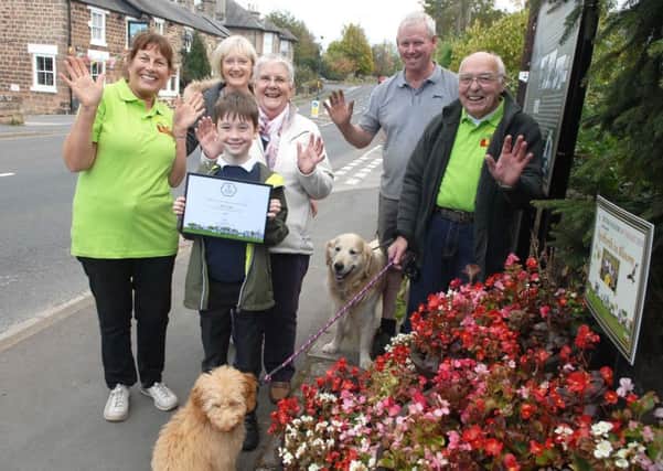 NAWN 1810235AM1 Spofforth in Bloom. Nine years old Charlie Murray with Lynda Parkinson(chair of Spofforth in Bloom) members Ann Horne, Ann Rae, John Horne, Duncan Rae, dogs Daisy and Harvey.(1810235AM1)