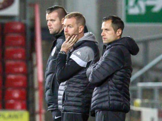 Simon Weaver, centre, and his assistant Paul Thirlwell look on from the sidelines during Tuesday's FA Cup loss at Wrexham. Picture: Matt Kirkham