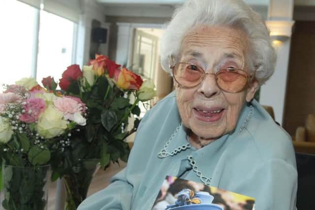 Mrs Flowers with her fourth birthday card from the Queen