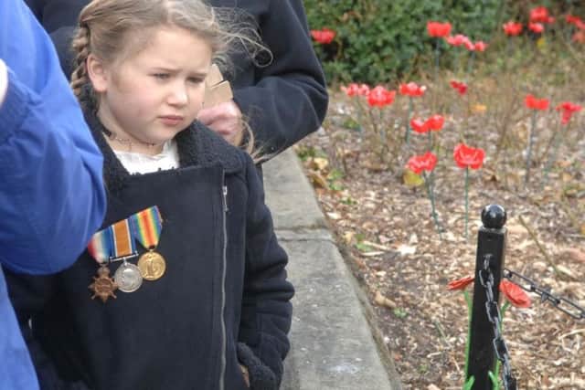 Ruby Fielding, 8, wears her great grandfathers medals with pride. (1811041AM4)