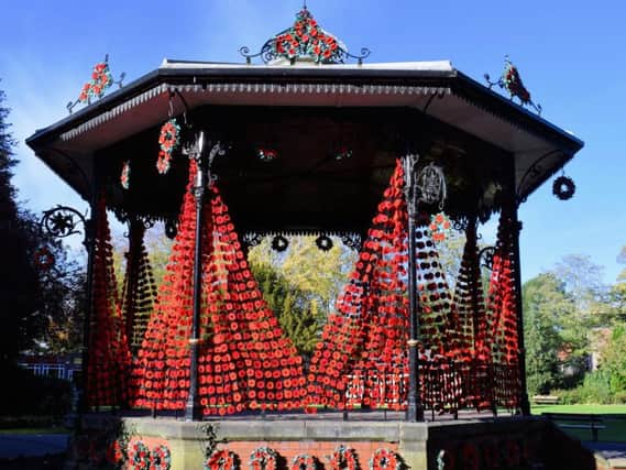 Curtains of poppies decorating Ripon Spa Gardens bandstand.