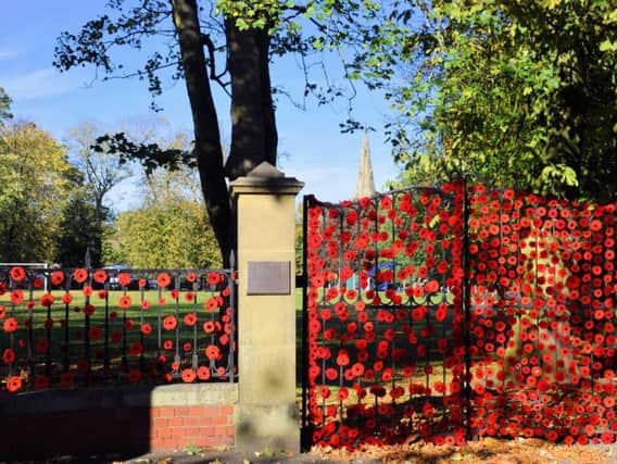 Ripon Spa Gardens gates decorated with poppies. Picture: Rodney Towers.