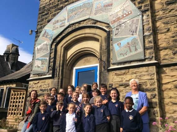 St Cuthbert's C of E Primary School pupils and teachers with the new mosaic.