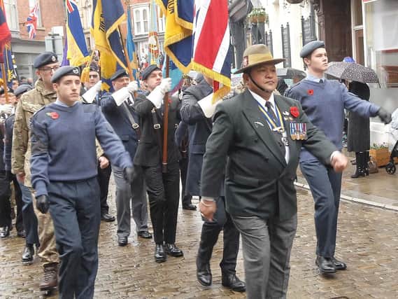 The Chairman of Ripon Royal British Legion, Jeet Bahadur Sahi leads the Remembrance parade down Kirkgate.